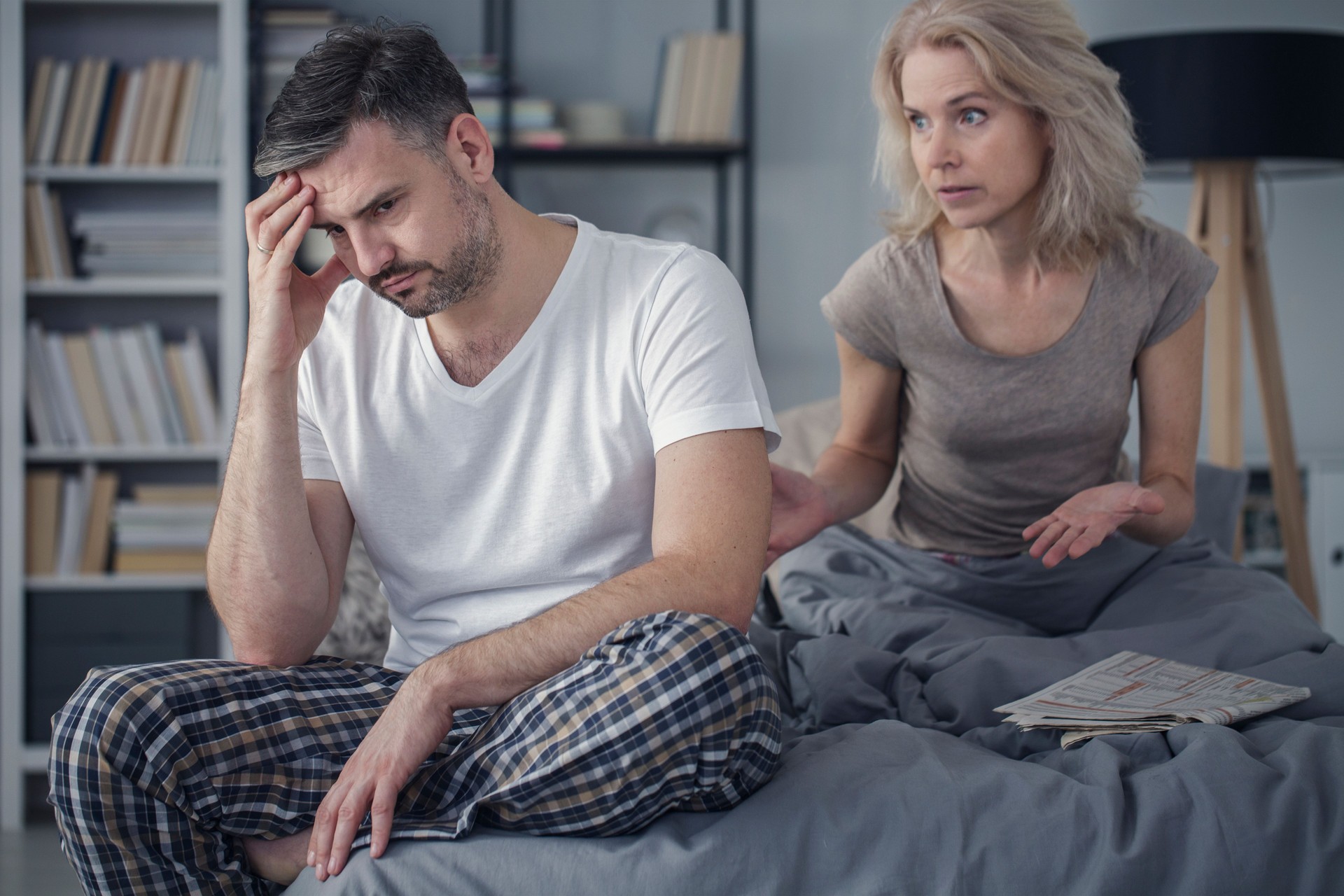 Married couple arguing in bedroom